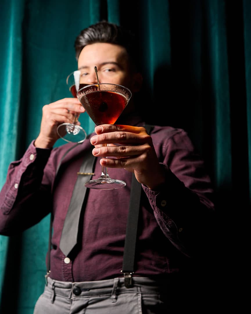 Bartender preparing cocktails at The Whisper