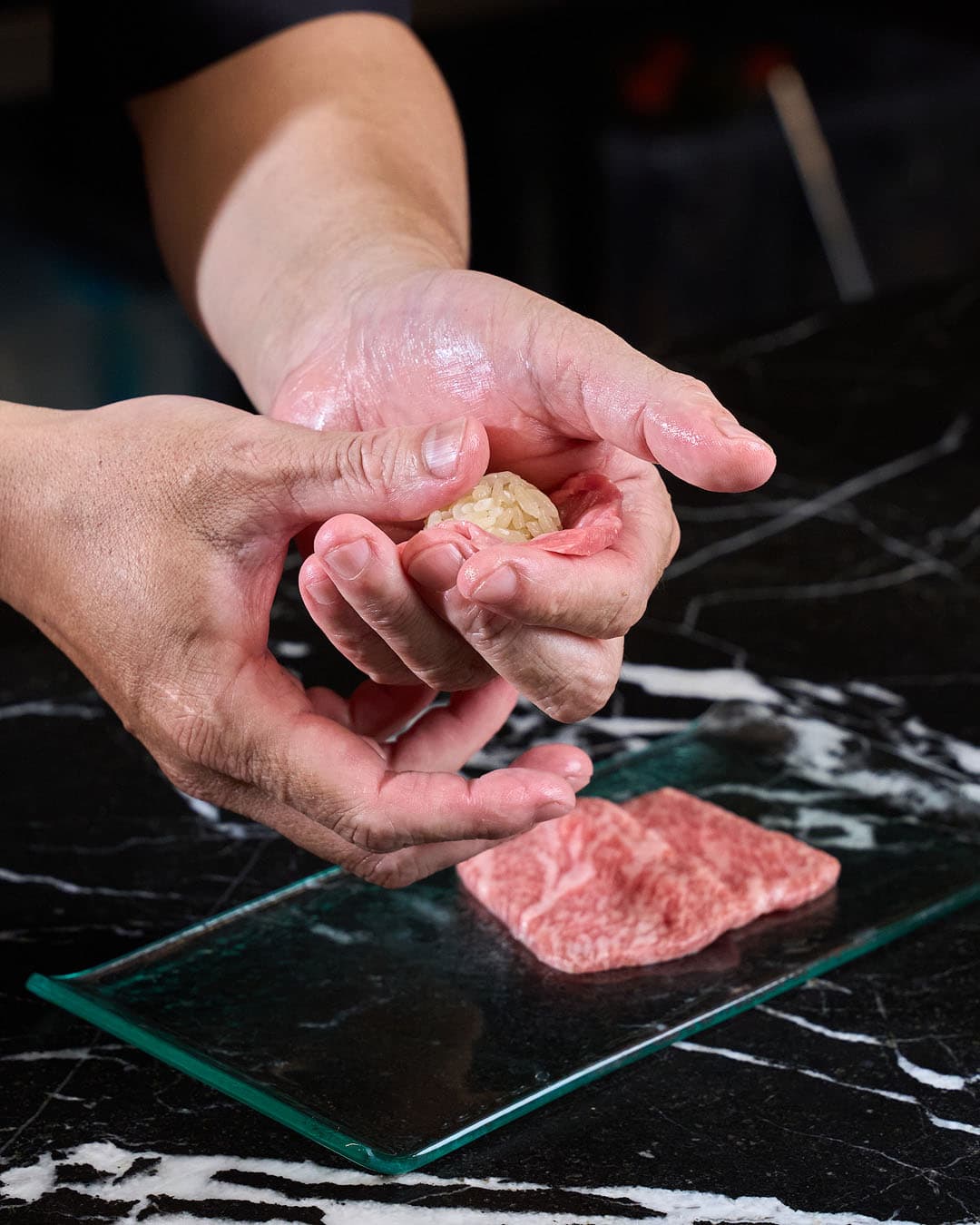 Preparing nigiri in the kitchen at Daikichi Beach, Alicante