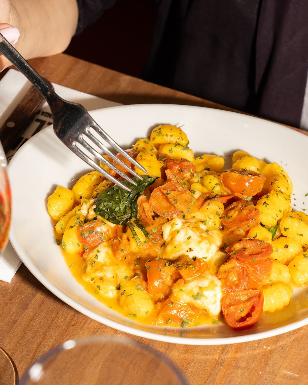 Gluten-free gnocchi with shallot, cherry tomatoes and mozzarella at Nonna Celia, Alicante